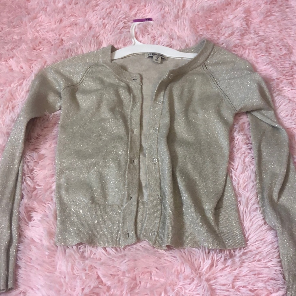 A tan glitter cardigan